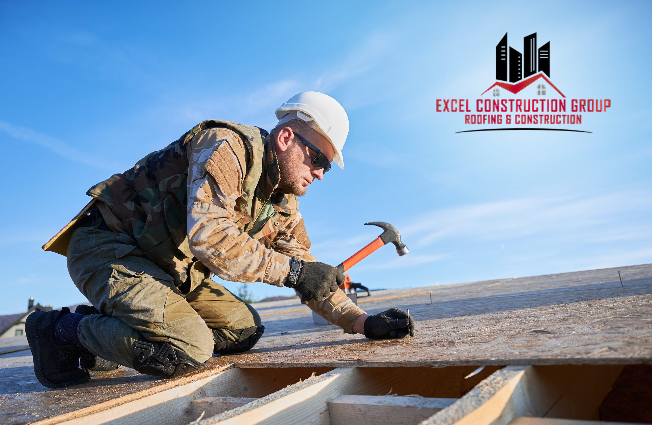 Carpenter hammering nail into OSB panel while building wooden frame house. Importance of finding a licensed roofing contractor in Watauga