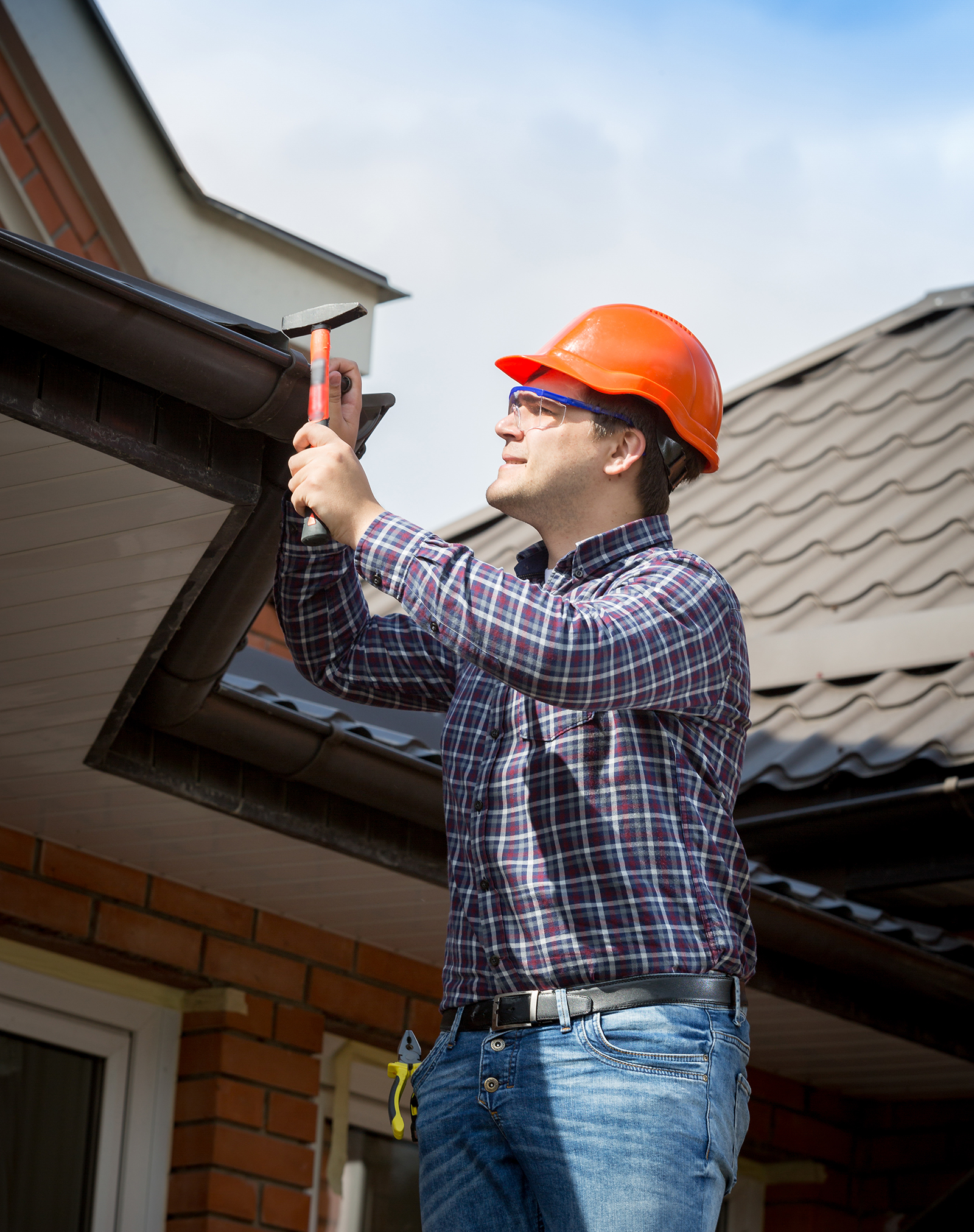 young-handyman-repairing Excel Construction Group: Residential Contractor in Watauga