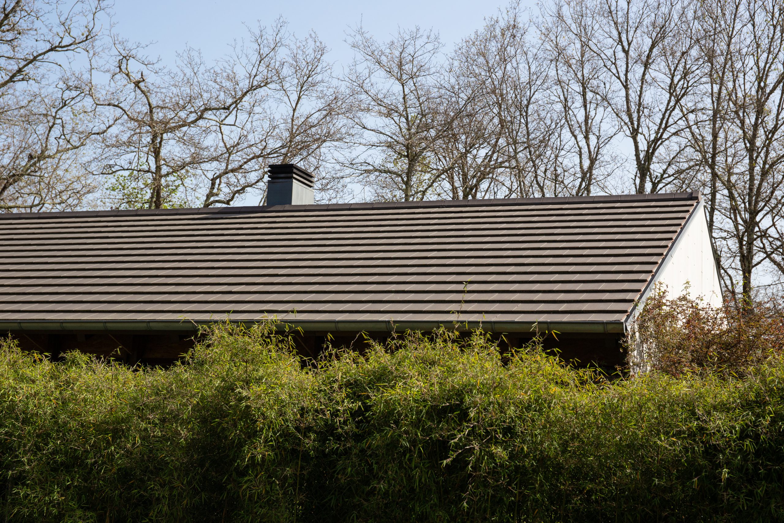 Flat roof tile house. Architecture detail Importance of Proper Flat Roof Sloping