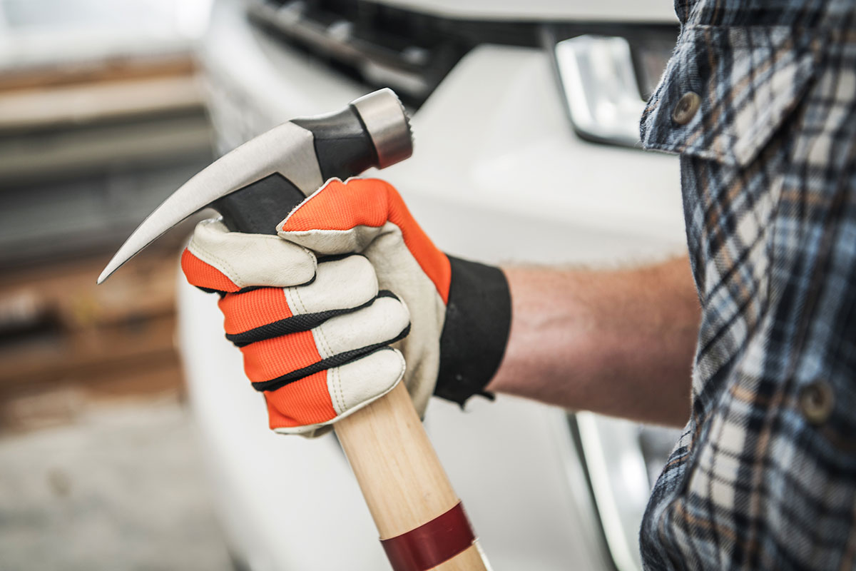 large-hammer-in-contractors-hand-2022-12-16-11-43-57-utc How to Find a Good Roofing Contractor in Denver