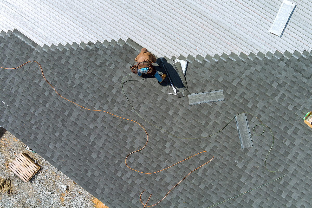 a-asphalt-shingles-installation-on-the-roof-roofer-2022-11-12-11-28-43-utc-(5) Is Roof Replacement Tax Deductible?