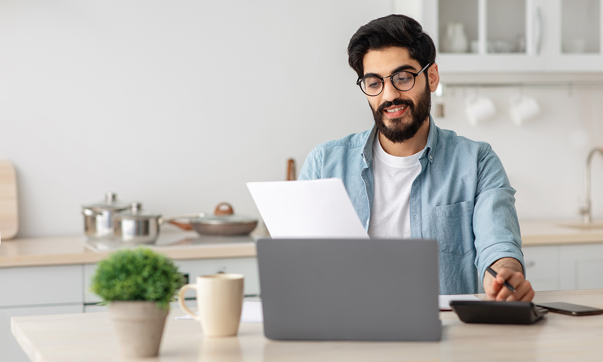 portrait-of-happy-arab-guy-reading-insurance-docum-2022-12-16-07-31-29-utc Wear and Tear or Covered Damage?