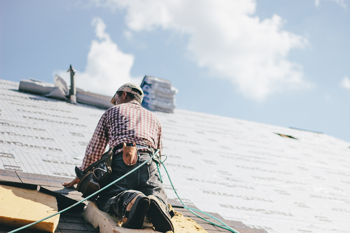 roofer-adding-shingles-to-the-roof-of-a-house-2022-11-16-18-35-52-utc-(1) Affordable Roofing Installation in Denver