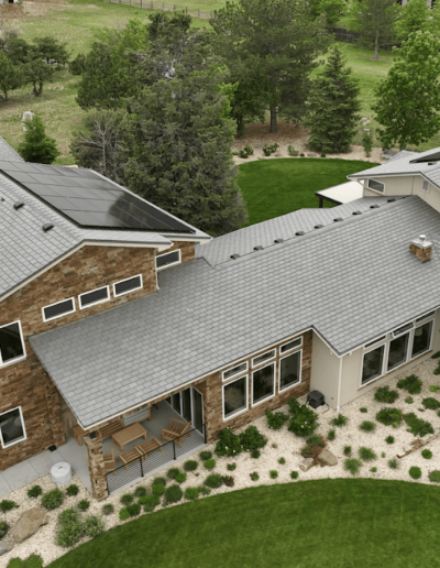 large house in lewisville texas with new roof and exterior brick siding repair